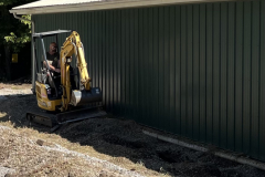 Cleaning out drainage ditch from flood damage